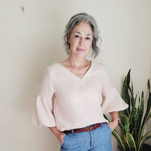 Load image into Gallery viewer, Grey haired model wearing soft pink top and denim shorts.  A soft classic look.

