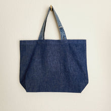 Load image into Gallery viewer, Love Never Fails Denim Tote Bag

