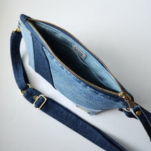 Load image into Gallery viewer, This versatile carryall has a lightweight denim strap to wear on the shoulder, crossbody, on belt or wrist. The bag is sewn in three shades of denim. Clean seams, modern minimal design with gold hardware accents.  
