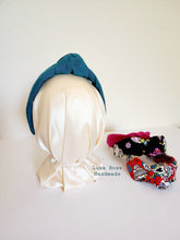 Load image into Gallery viewer, Luxurious teal green knotted headband in linen. 
