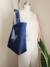 Load image into Gallery viewer, Love Conquers All Denim Tote Bag

