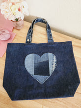 Load image into Gallery viewer, Love Never Fails Denim Tote Bag
